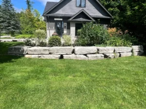Professional armour stone garden wall installation by Big G Landscapes