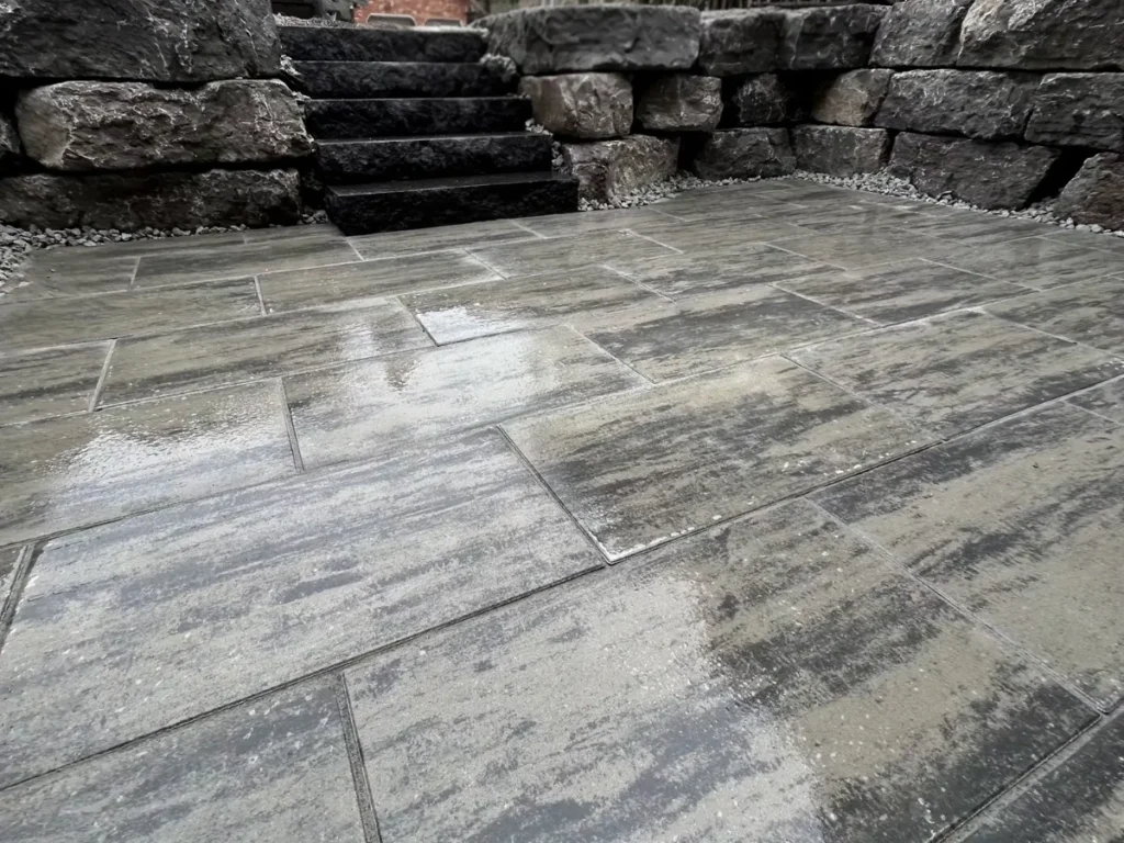 Custom stone hardscaping including pavers and steps by Big G Landscapes