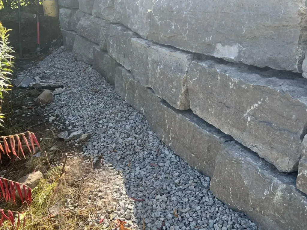 Professional armour stone retaining wall installation in Barrie, ON by Big G Landscapes
