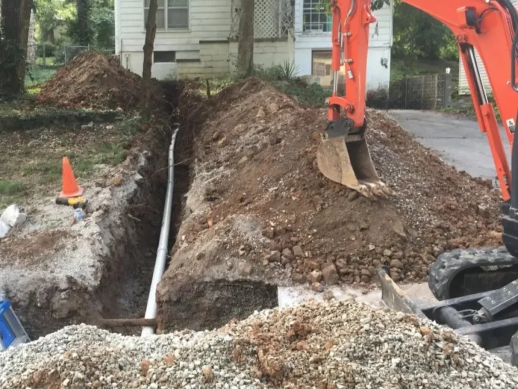 Excavation trenching work with pipe installation completed by Big G Landscapes & Contracting
