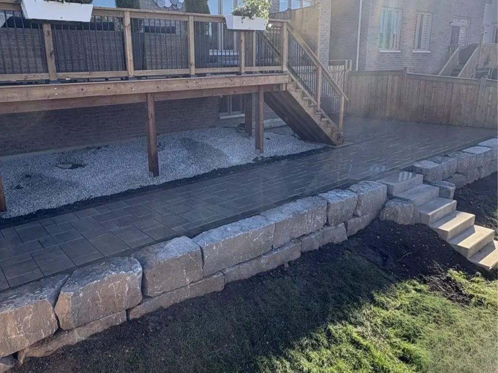 Landscape land levelling and stone edging installation in Barrie